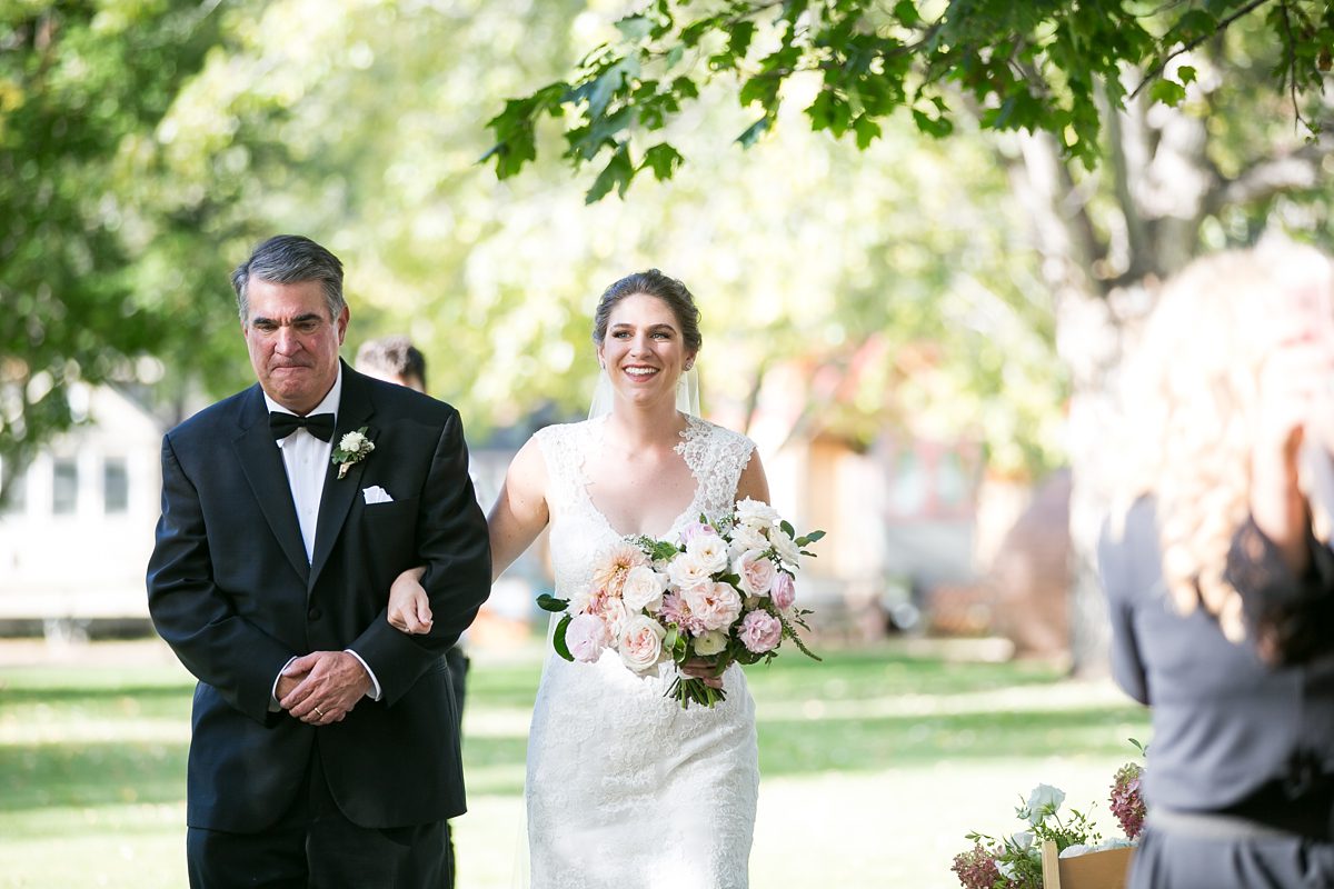 Happy bride and her dad down the aisle, Colorado Riverbend Farmette Wedding, by Amy Caroline Photography