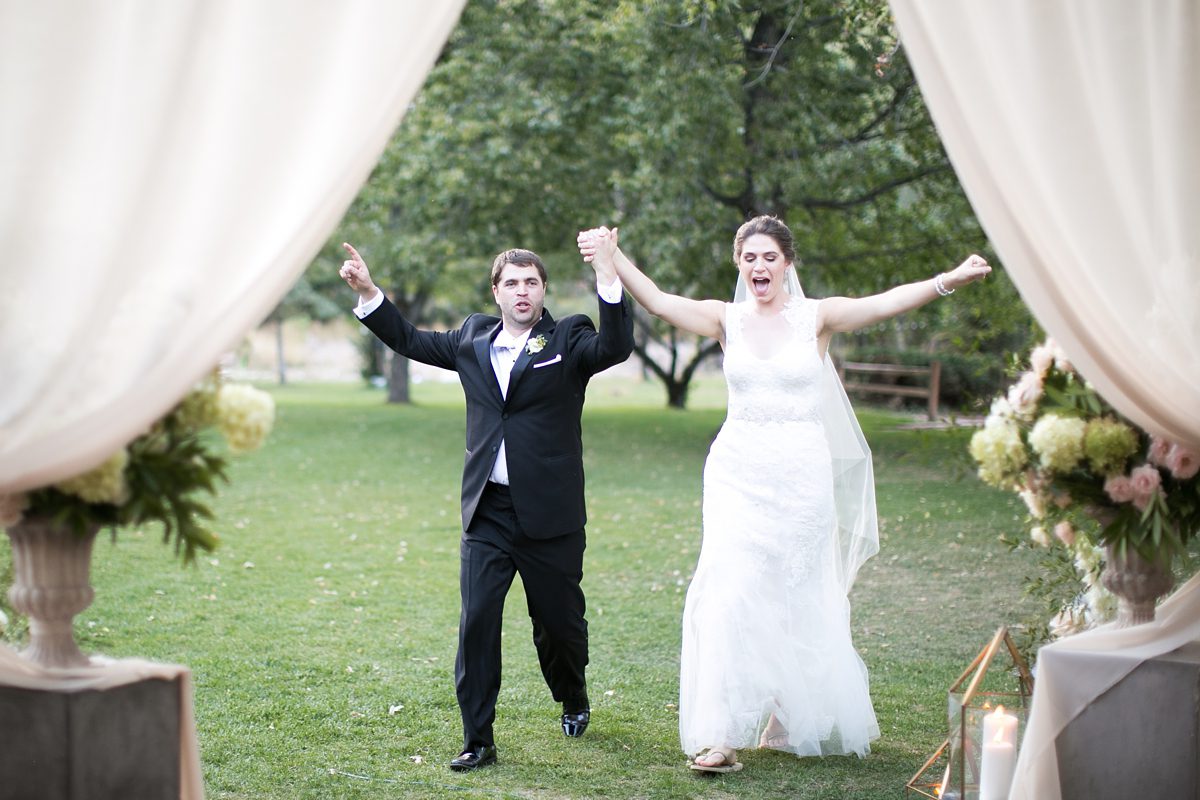 Joyful bride and groom at Lyons Farmette Riverbend