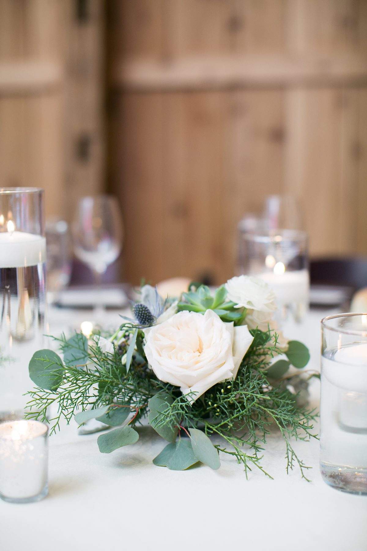 Winter Wedding table flowers, Colorado Devils Thumb Ranch Winter Mountain Wedding, Amy Caroline Photography