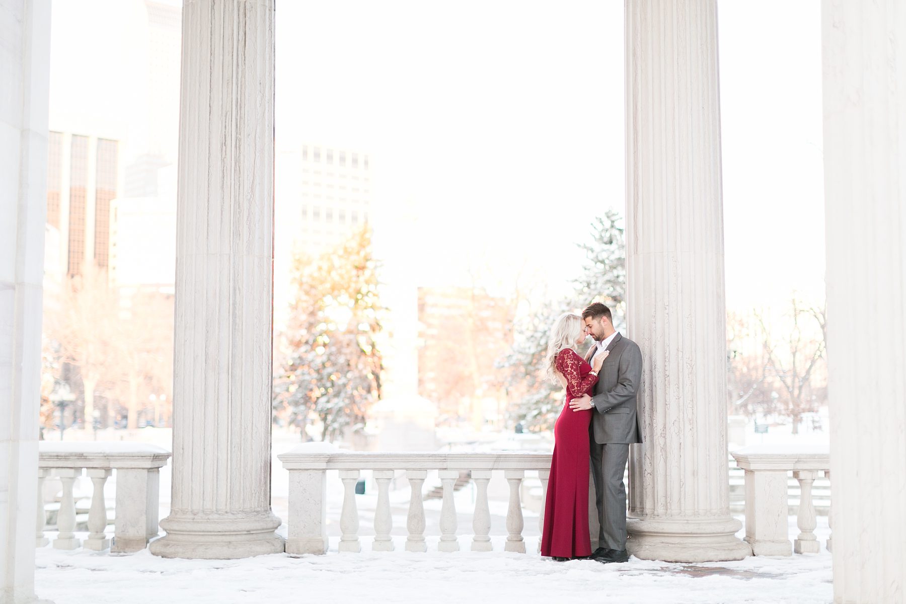 Romantic and elegant downtown Denver engagement pictures, red dress with lace long sleeves, Amy Caroline Photography 