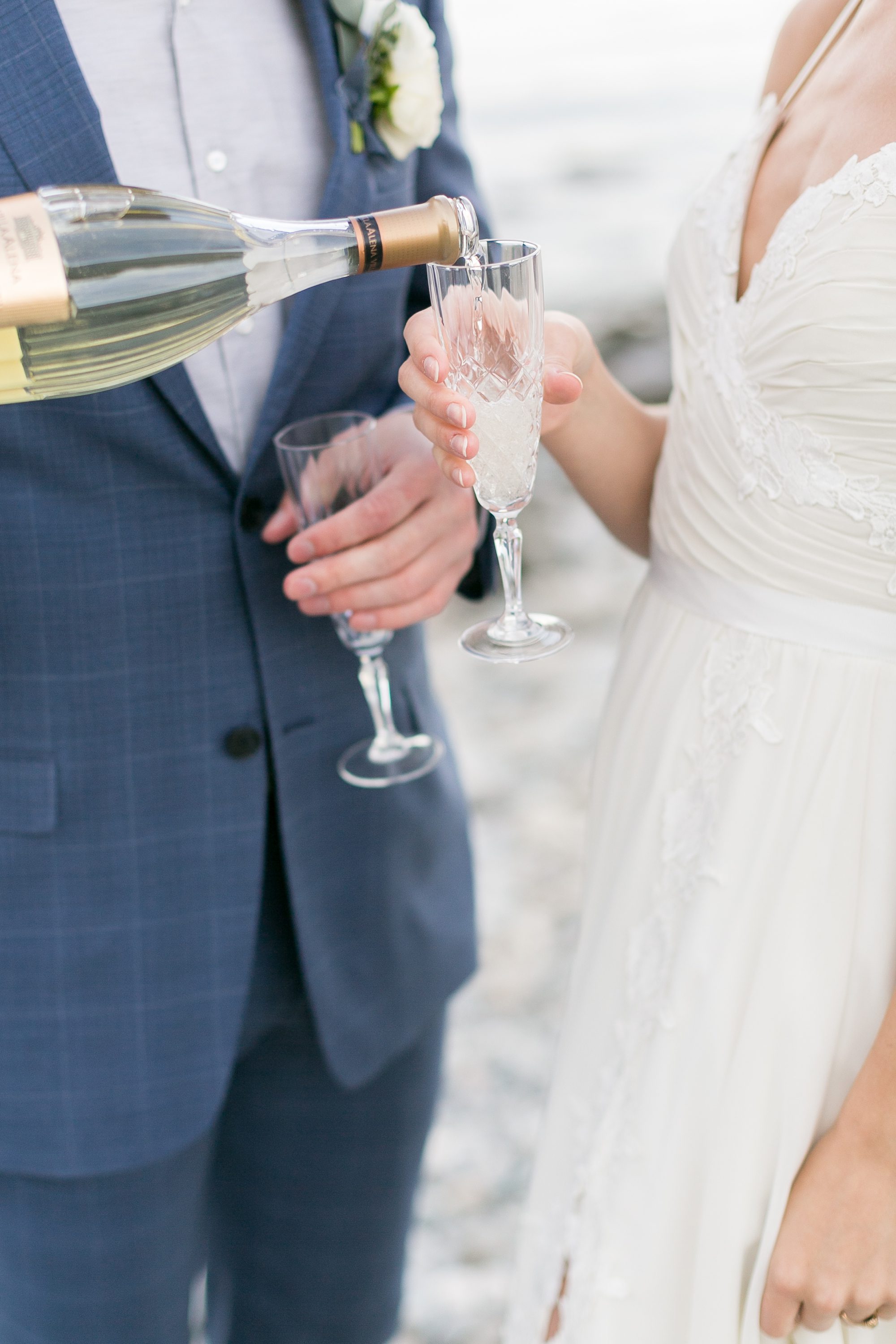 Bride and groom toast, bride and groom elope on the beaches of Maine, Maine Wedding, Amy Caroline Photography 