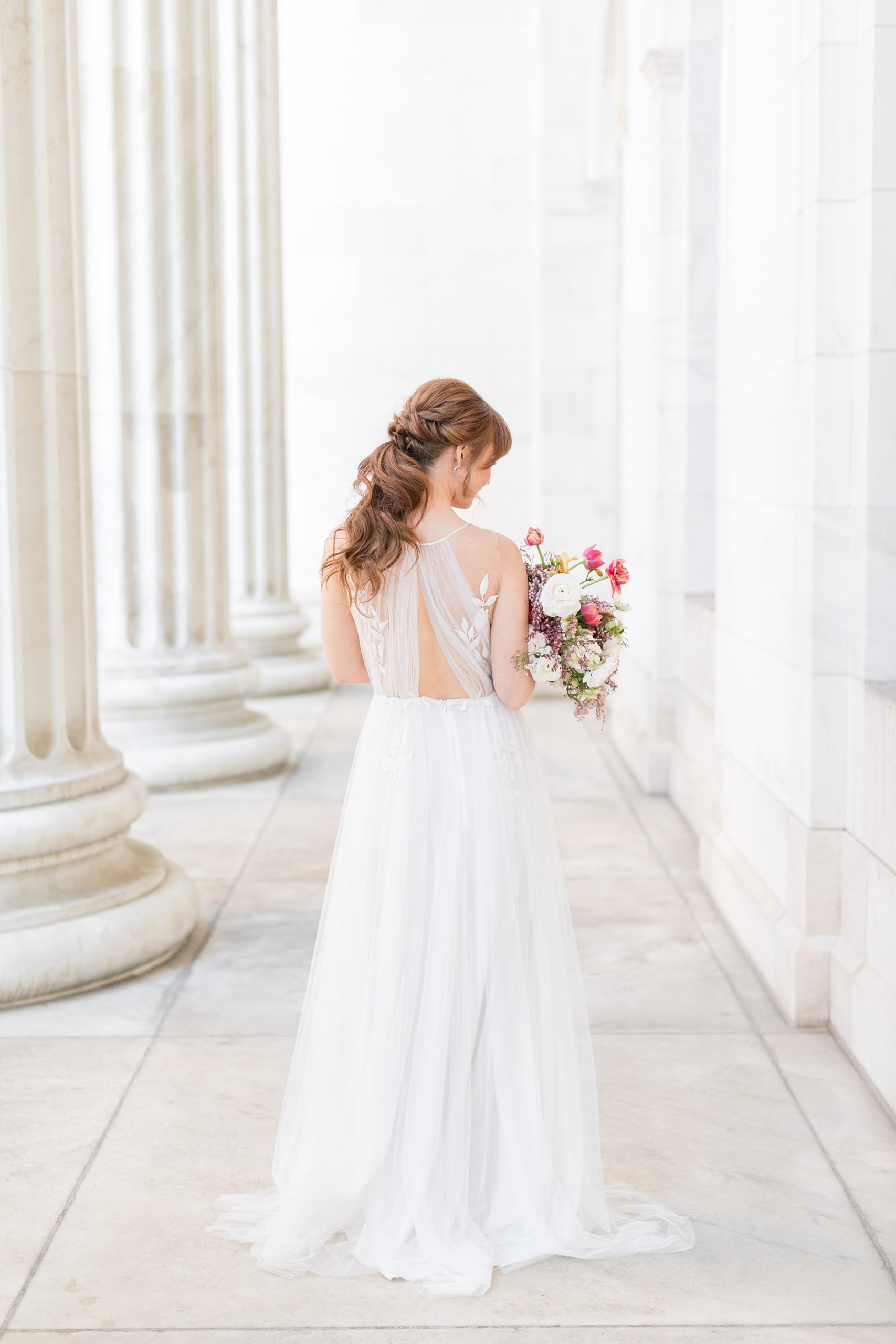 Elegant Bridal Ponytail Hairdos by Denver's Liana Kathryn. Unique Bridal Gown with Open Back by Anna Kara. Photographed by Denver Colorado Wedding Photographer, Amy Caroline Photography. Chic Downtown Denver Bridal Session.
