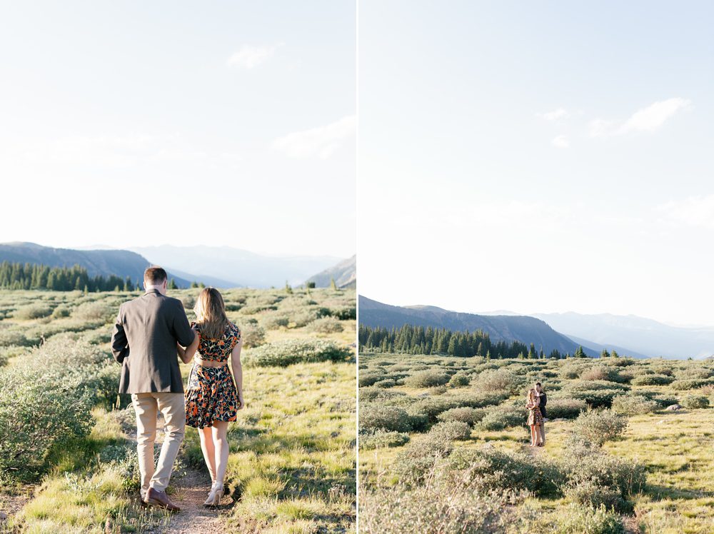Joyful engaged couple walking in the mountains Colorado at golden hour
