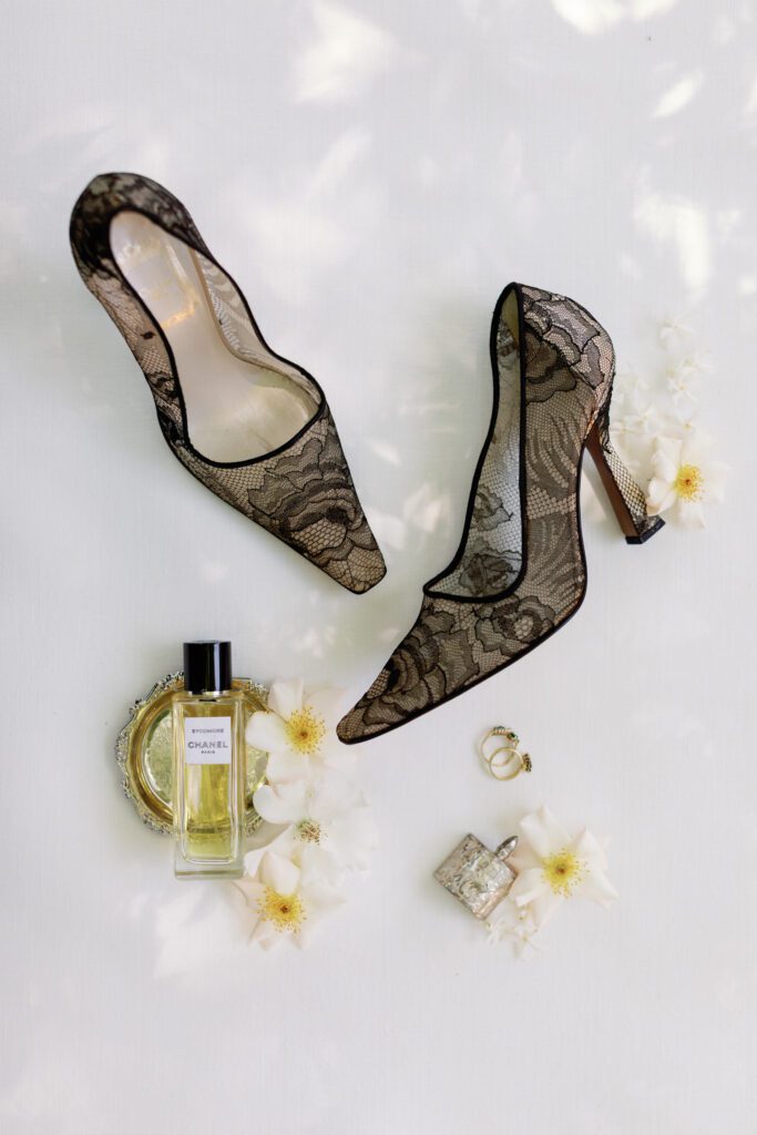 Black lace vintage Christian Louboutin wedding heels, Chanel perfume, and bridal rings styled for a Tre Posti wedding in Napa Valley